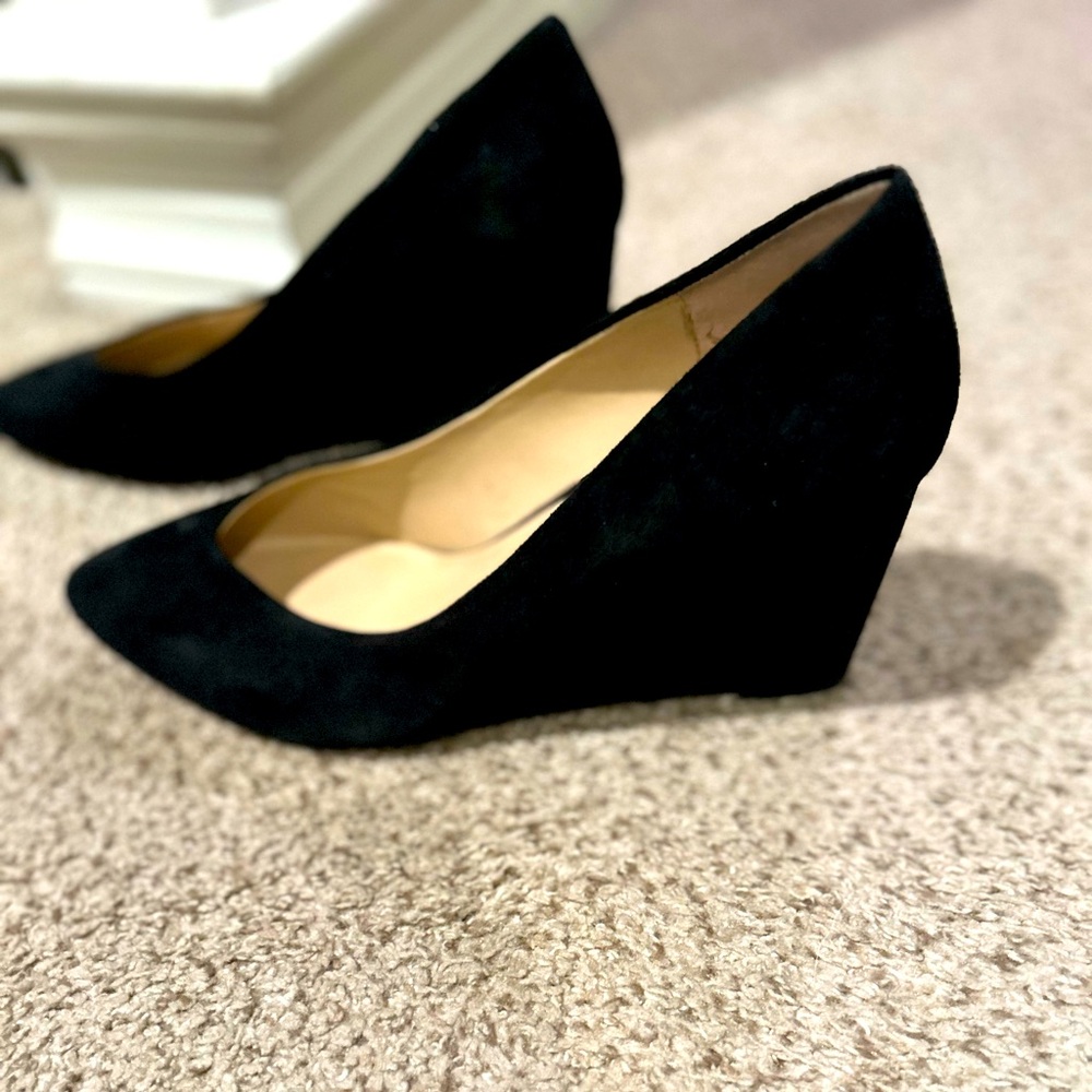 Only work once. Wedge black suede heel.